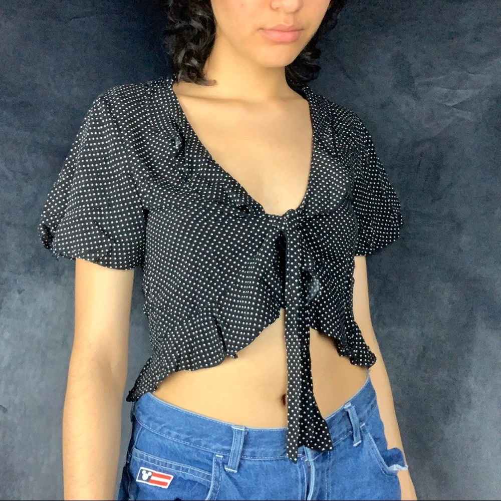 Black wrap polka dot print blouse.
